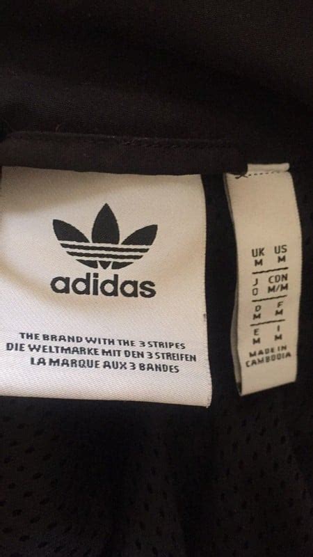 how to tell if adidas jacket is fake|adidas jacket detachable label.